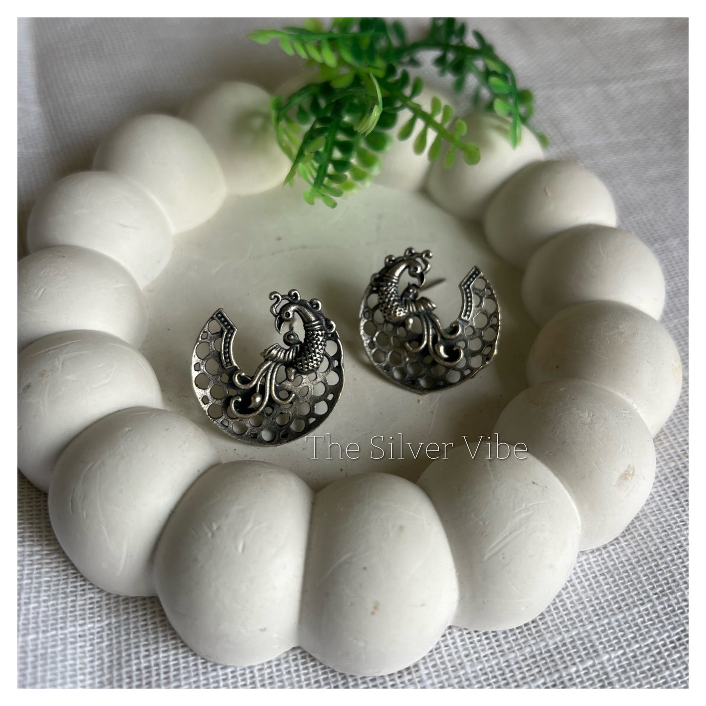 Black polished peacock studs TSV1074